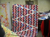 Karen-S.-shows-her-Quilt-of-Honor-scaled