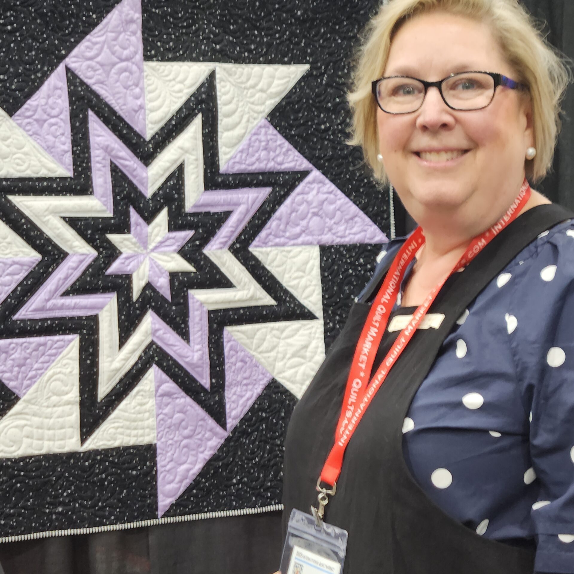 Gill with quilt at Houston Festival